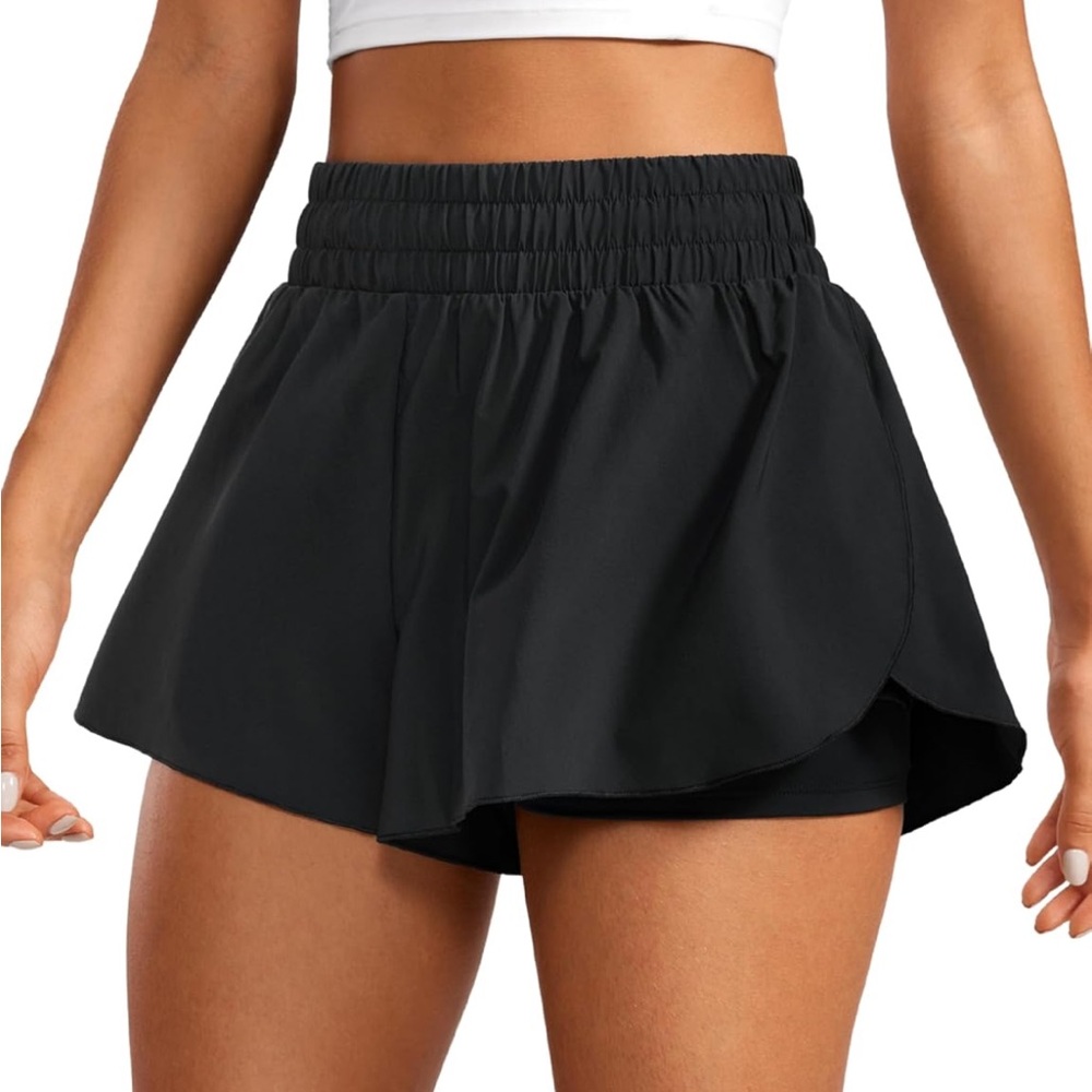Navy blue flowy workout shorts with built in spandex